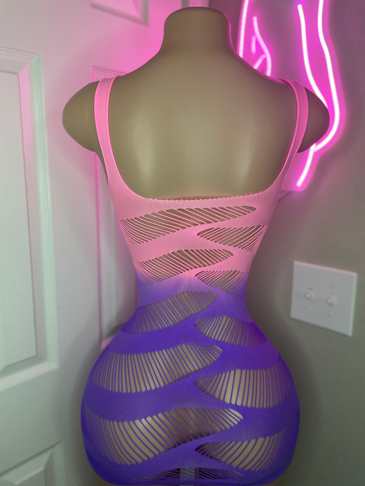 Pink to purple ombre slash-cut mini dress back view showing open-back slash detail