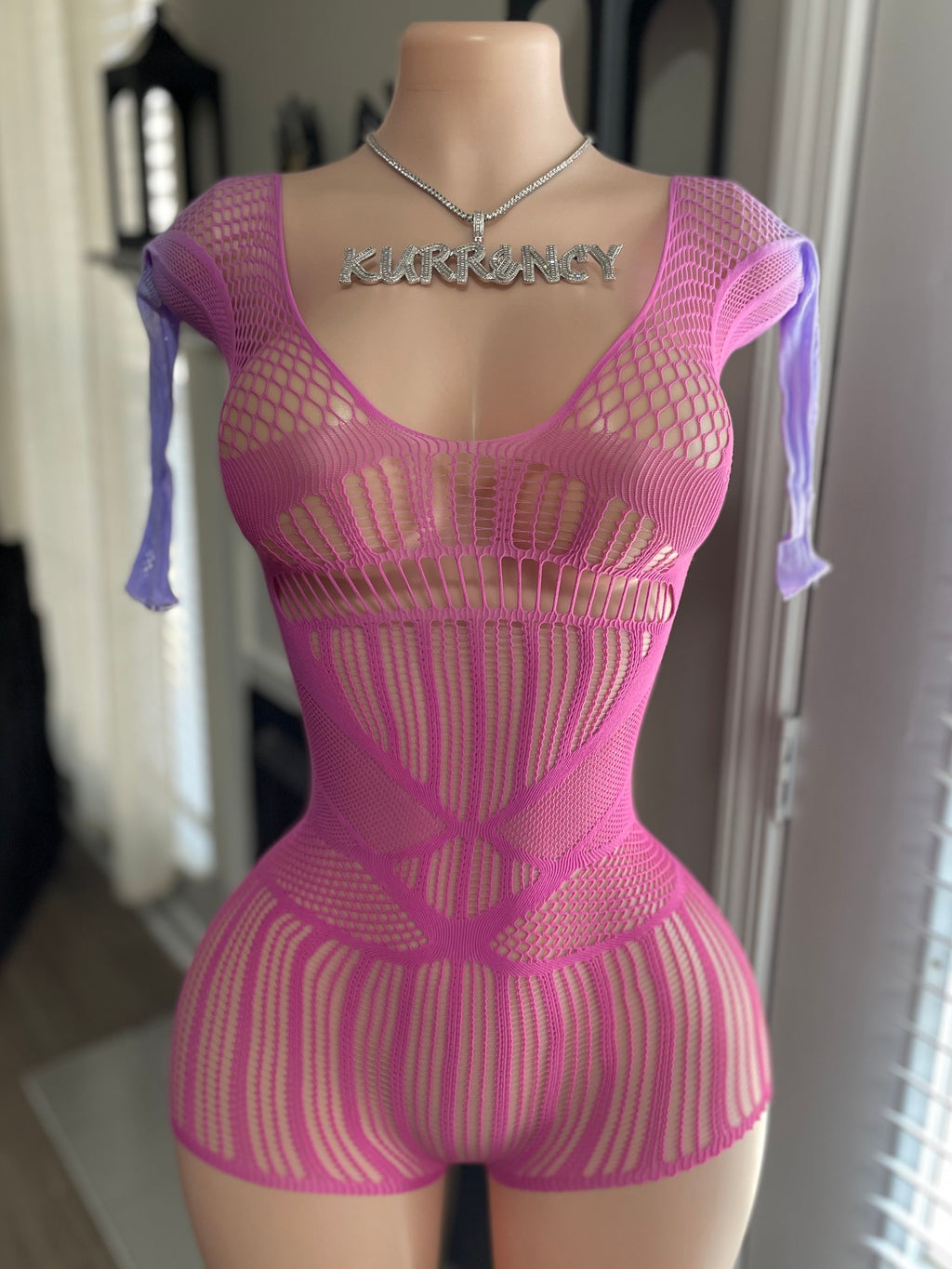 Hot pink mixed-knit fishnet mini romper front view with lavender ribbon sleeve ties