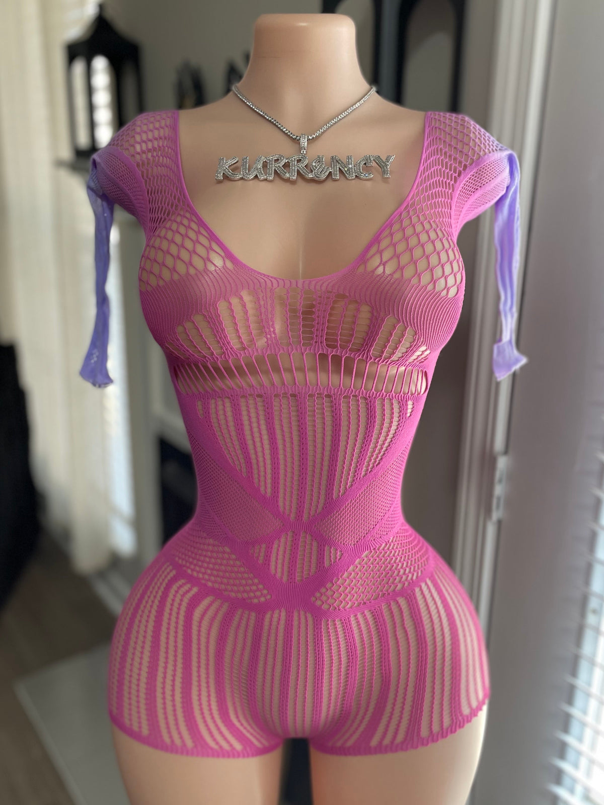 Hot pink mixed-knit fishnet mini romper front view with lavender ribbon sleeve ties