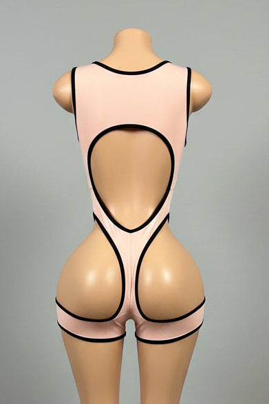 Blush pink multi-cutout bodysuit front view with black contrast trim