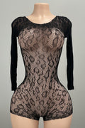 Back view of black snakeskin lace open back mini romper showing deep scoop back
