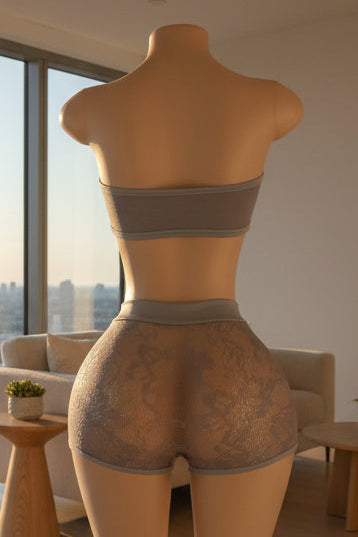 Back view of periwinkle blue lace criss-cross bandeau and shorts set on mannequin
