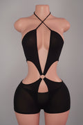 Black cutout romper with criss-cross halter neck and O-ring hardware on mannequin