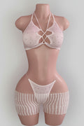 White rhinestone lace-up bikini top with fringe mini skirt set on mannequin